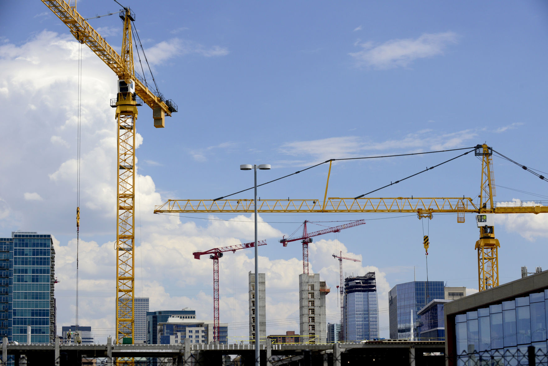 COVER STORY Building with Cranes Denver skyline
